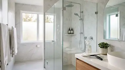 large bathroom with floor to ceiling glass shower doors and a large window in the shower looking out the the yard