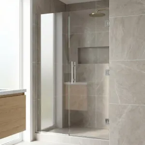 Frameless single swinging shower door with brushed nickel hardware in a grey marble tiled alcove